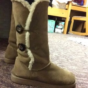 Tan winter boots with buttons on the side